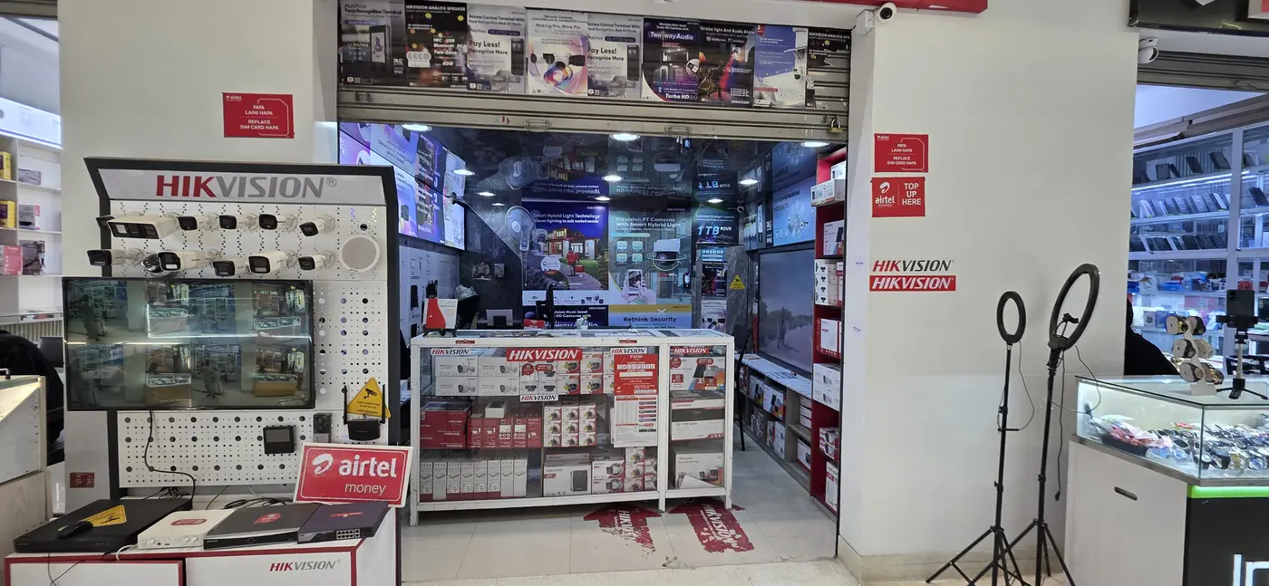 Hikvision camera display stand and stocked counter at the NE showroom entrance